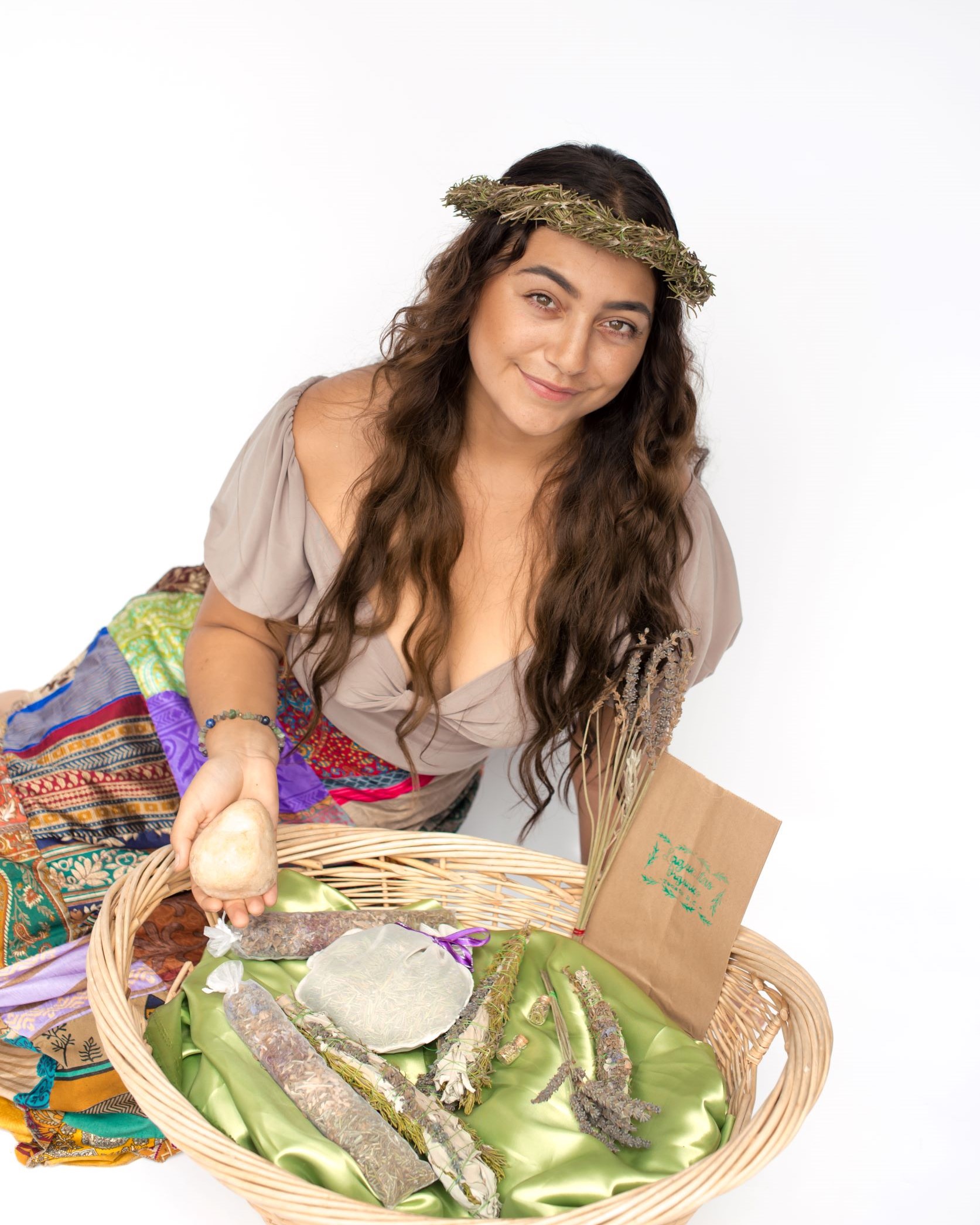 Photo of Amalia with a basket of Lagunitas Organics aura wands and aromatherapy pillows